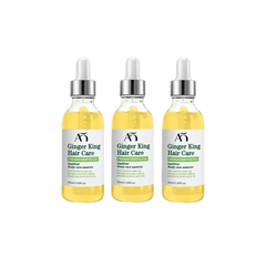 Three transparent glass bottles with silver droppers containing golden-yellow ginger king hair care growth oil serum by wprbregt
