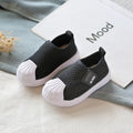 Black breathable mesh slip-on sneakers for toddlers and kids with white rubber toe caps soles and ab-kids logo patch