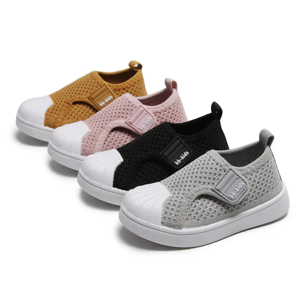 Children’s breathable mesh slip on sneakers in mustard pink black and gray with white rubber toe caps for toddlers and kids