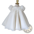 A girls white lace floral princess wedding dress featuring delicate satin fabric and puff sleeves with lace appliqués