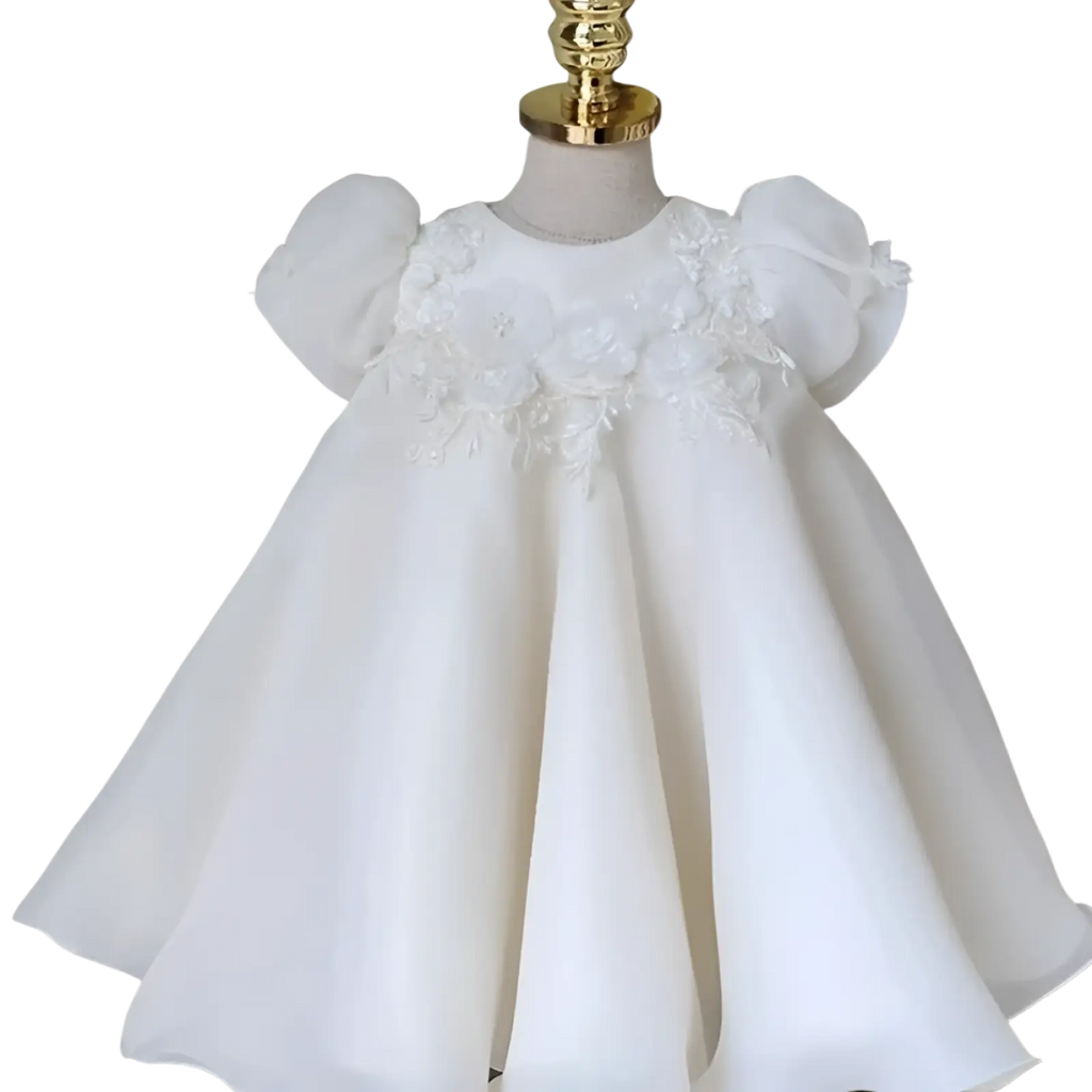 Girls white lace floral princess wedding dress featuring delicate puff sleeves and intricate bodice detailing