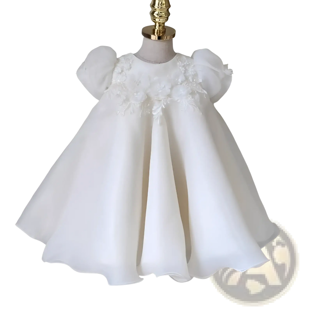 Girls white lace floral princess wedding dress with white floral embellishments, puffy sleeves, and a flowing skirt