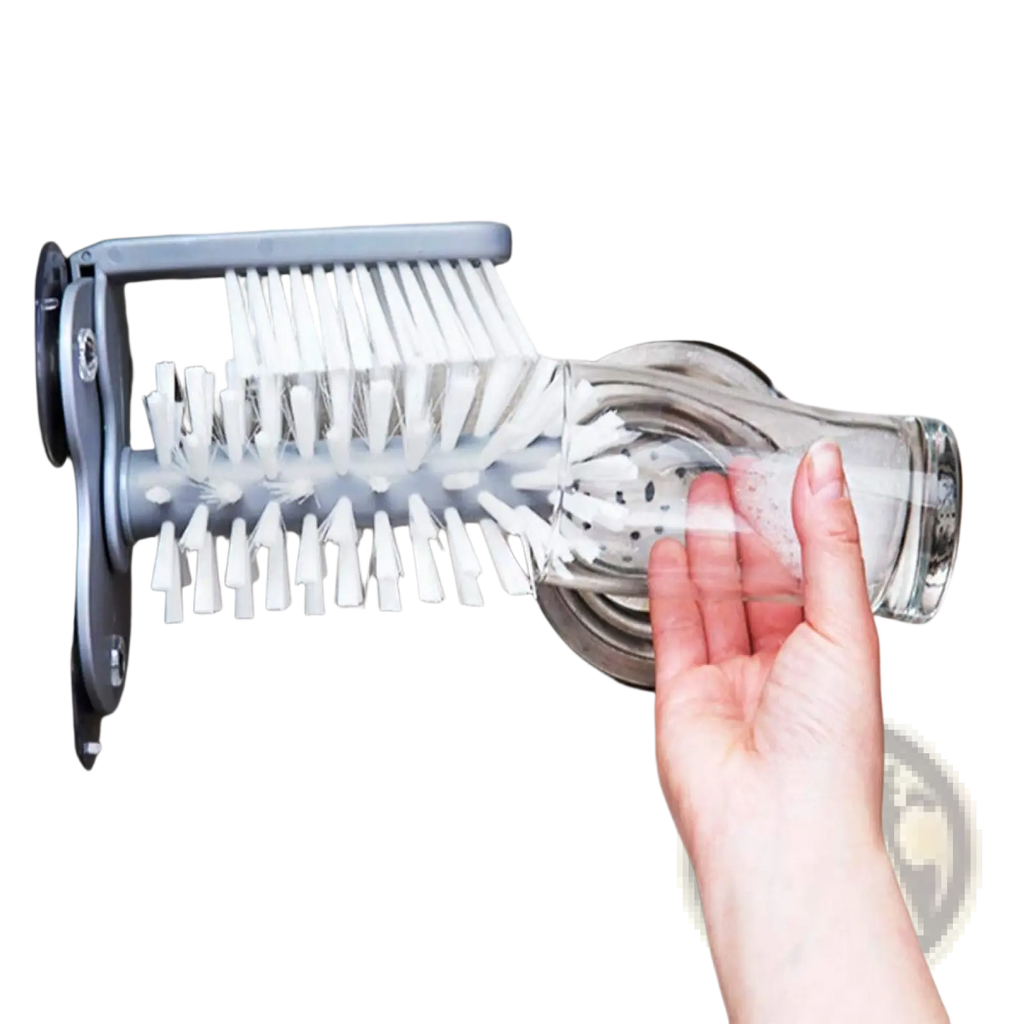 Gray plastic glass cleaning brush with white bristles and suction cup designed for cleaning glassware in the sink