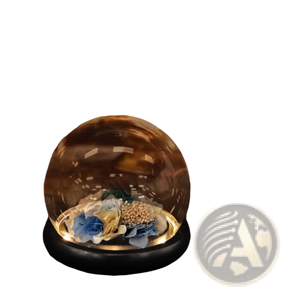Glass display dome with black base showcasing blue and gold fabric dried floral arrangement inside clear glass