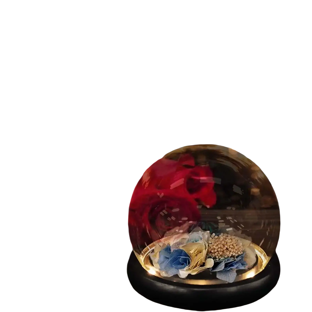 Glass display dome with a clear glass cover and black base featuring dried blue and gold floral arrangement