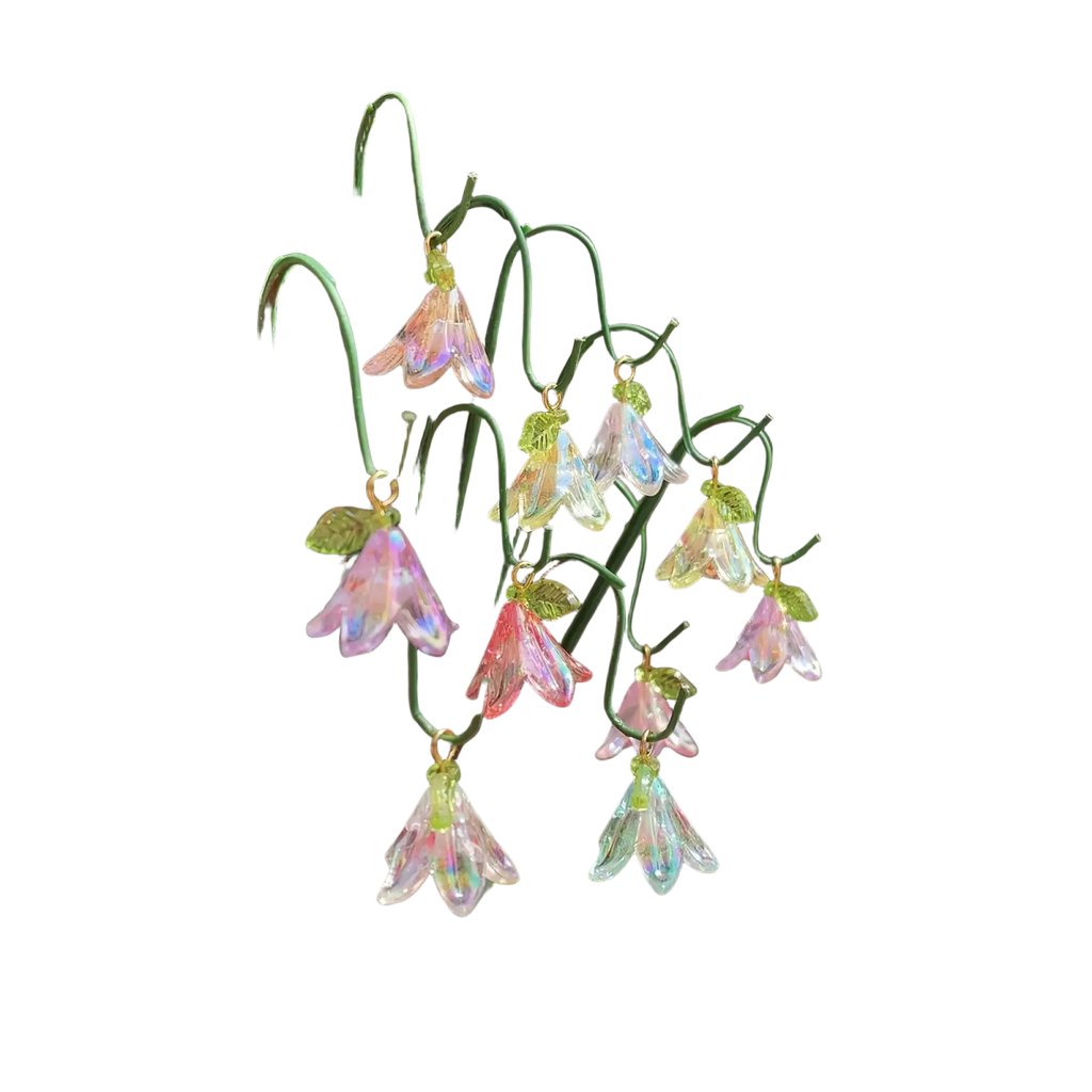 Glass lily garden stakes plant decor featuring iridescent glass bell-shaped flowers with green leaves on wire frame