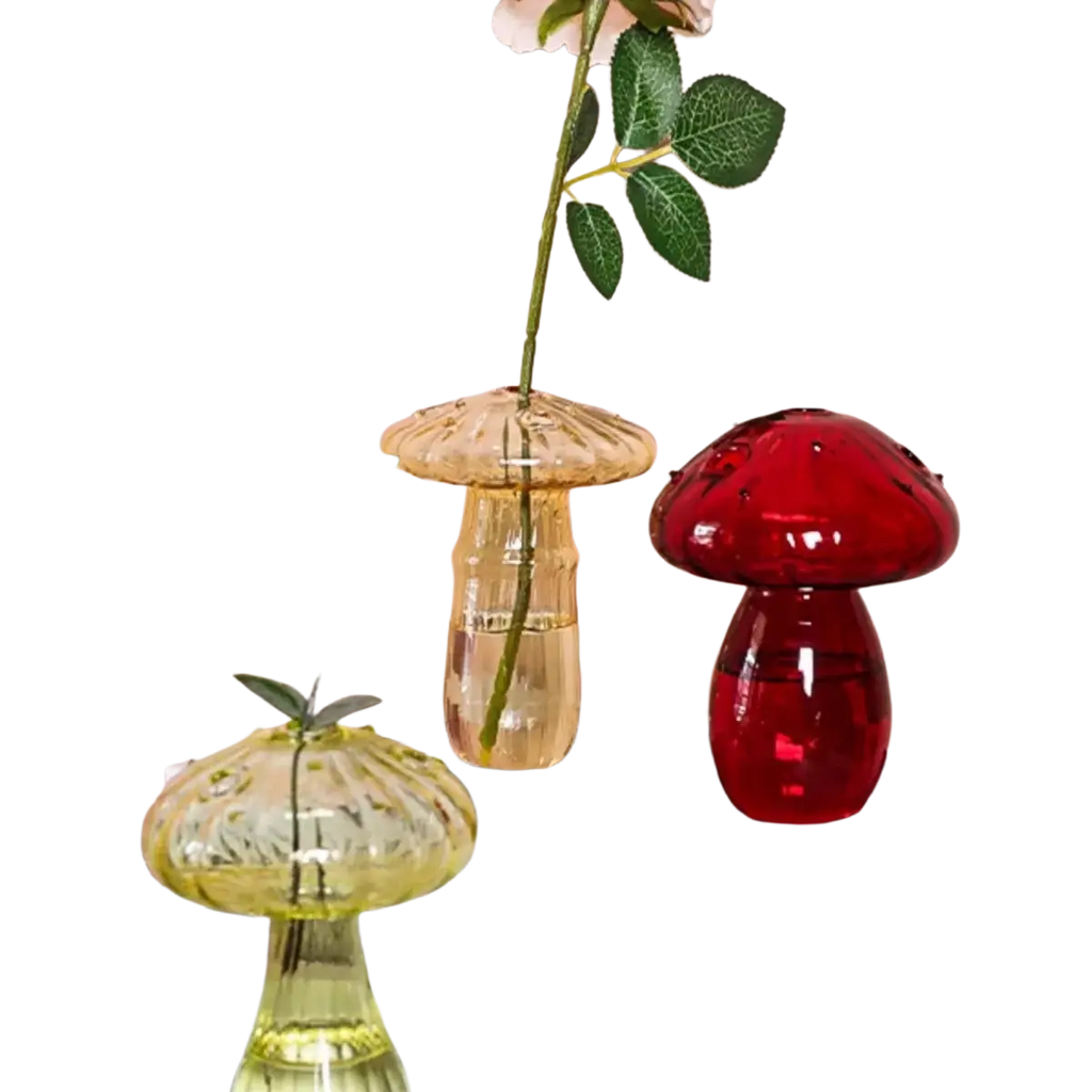 A translucent red glass mushroom bud vase with a glossy finish and textured cap for colorful Nordic plant holding