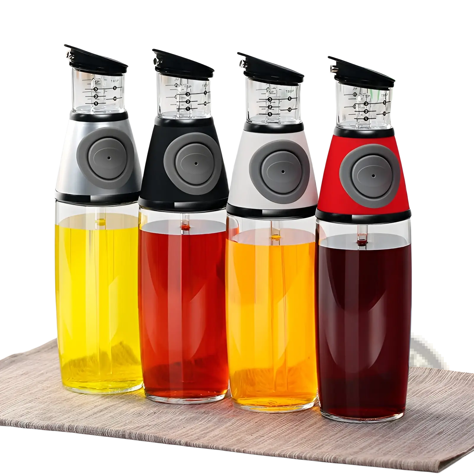 Four colorful transparent glass oil dispensers with black and gray tops and precision measuring cup markings
