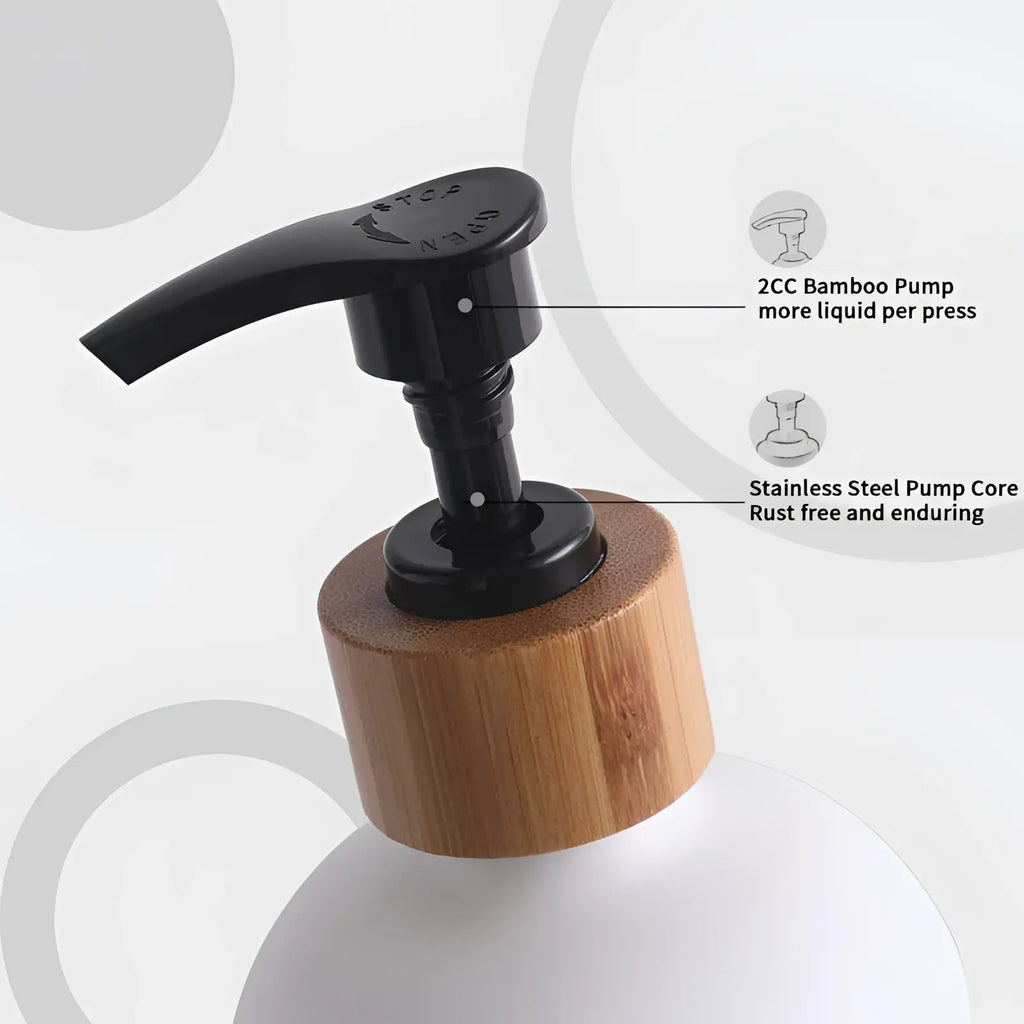 Glass soap dispenser set with bamboo tray featuring a stainless steel pump dispenser with matte black lever
