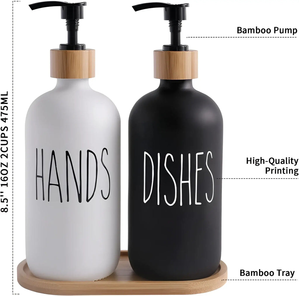 Glass soap dispenser set with white and black frosted glass and bamboo pump tops labeled hands and dishes on bamboo tray