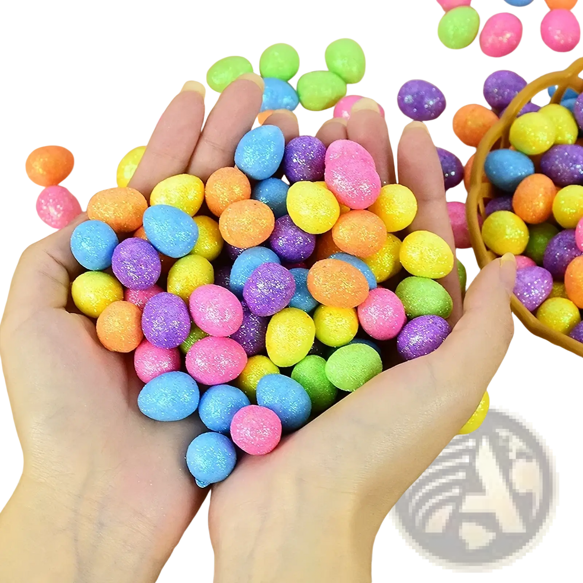 A hand holds colorful glitter easter foam eggs in pink blue yellow green orange and purple for diy party decor
