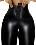 Black glossy faux leather high waisted shapewear leggings shown from the back with a central corset style lace up detail