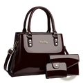 Glossy patent leather burgundy handbag set with gold-tone hardware including matching wallet and clutch