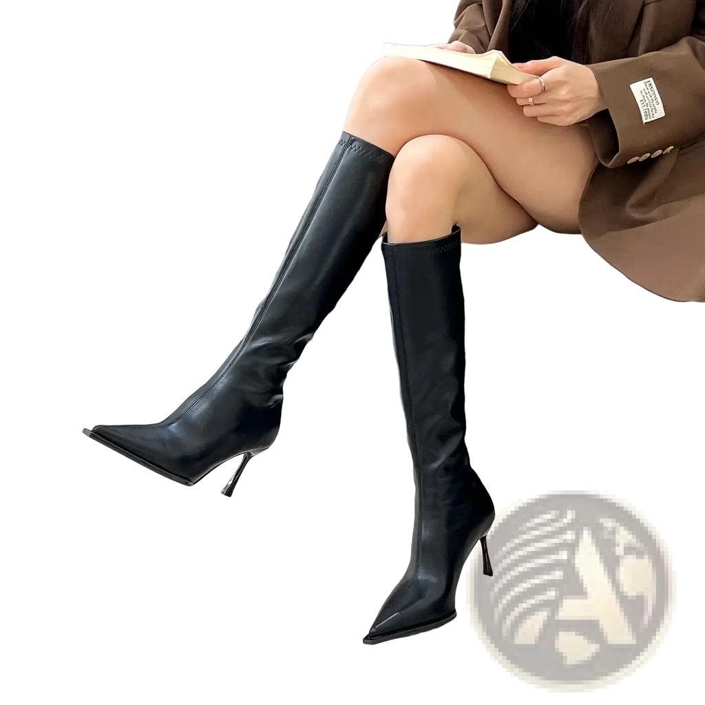 Glossy stiletto knee high boots in black leather with a sleek pointed toe and slender stiletto heel