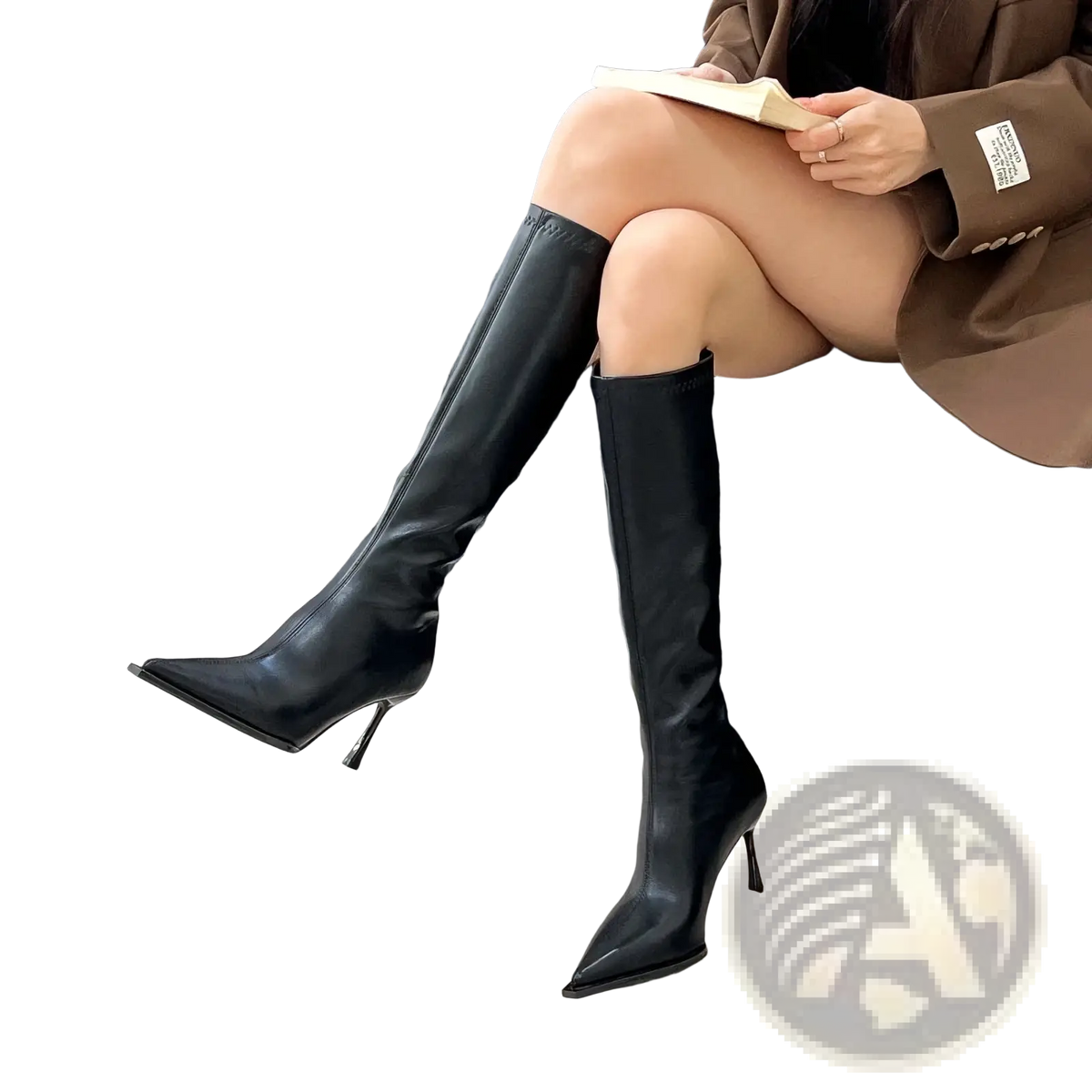 Glossy stiletto knee high boots in black leather with a sleek pointed toe and slender stiletto heel