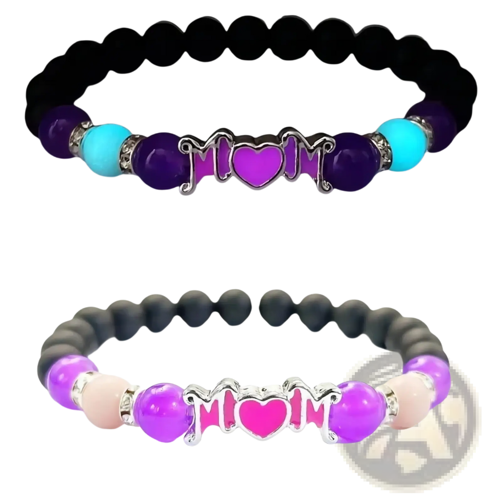 Glow in the dark mother bracelet with purple and black beads and a central silver mom charm featuring a heart shown glowing at night and daylight
