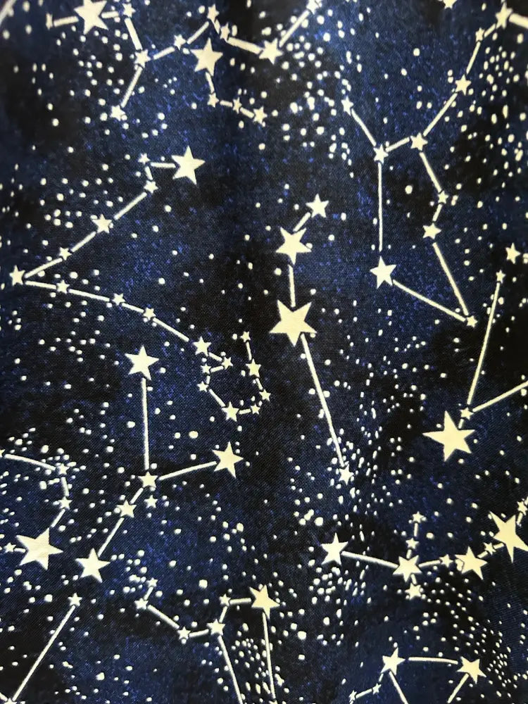 Dark blue cotton a-line skirt with glow in the dark white and gold constellation star pattern