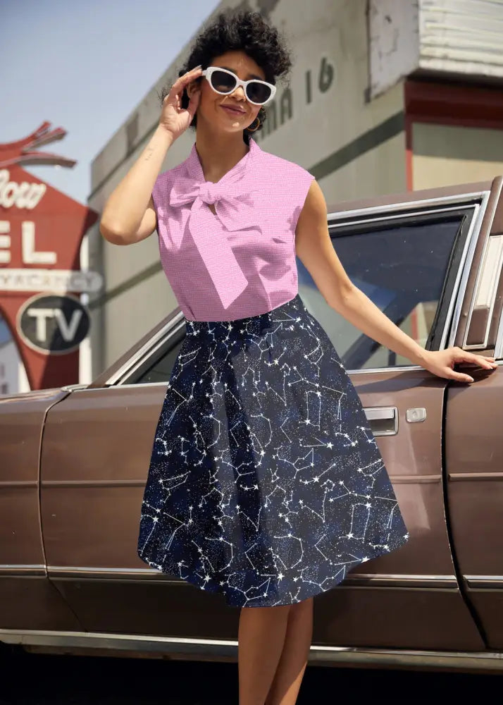 A navy cotton a-line skirt featuring a white glow in the dark constellation pattern