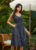 A navy blue sleeveless midi dress with glow in the dark constellation print square neckline and pockets
