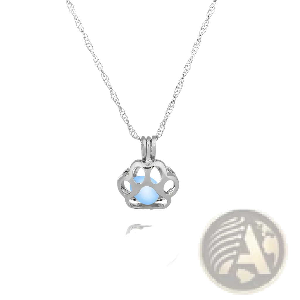 Silver paw print pendant necklace featuring a glowing light blue gemstone center for animal night light jewelry