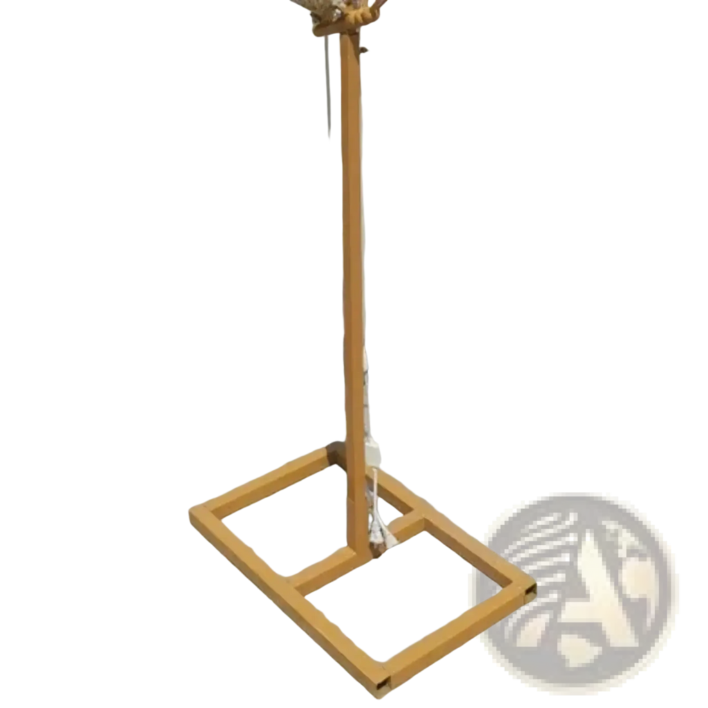 A golden metal stand with a square base and coiled rope top part of glowing butterfly wings hanging wedding stage light