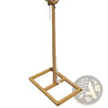 A golden metal stand with a square base and coiled rope top part of glowing butterfly wings hanging wedding stage light