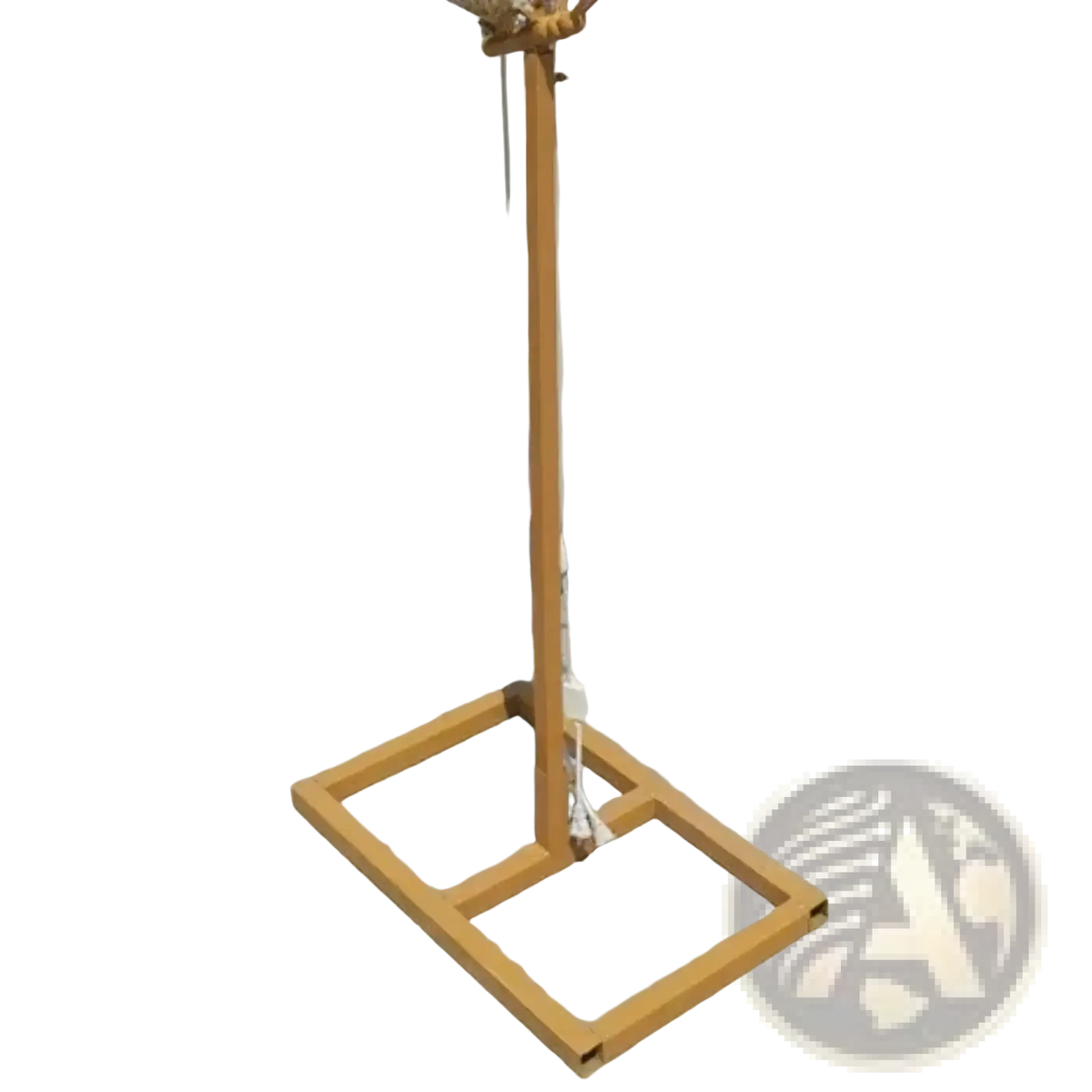 A golden metal stand with a square base and coiled rope top part of glowing butterfly wings hanging wedding stage light