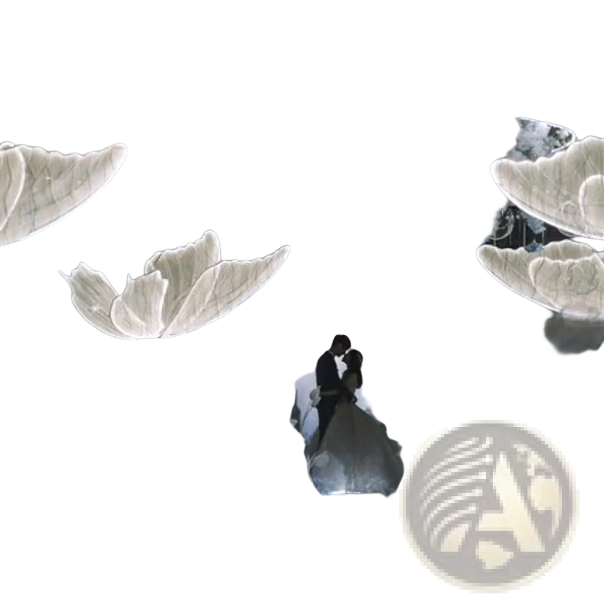 A glowing translucent white butterfly sculpture with delicate veined wings hanging in a wedding stage light