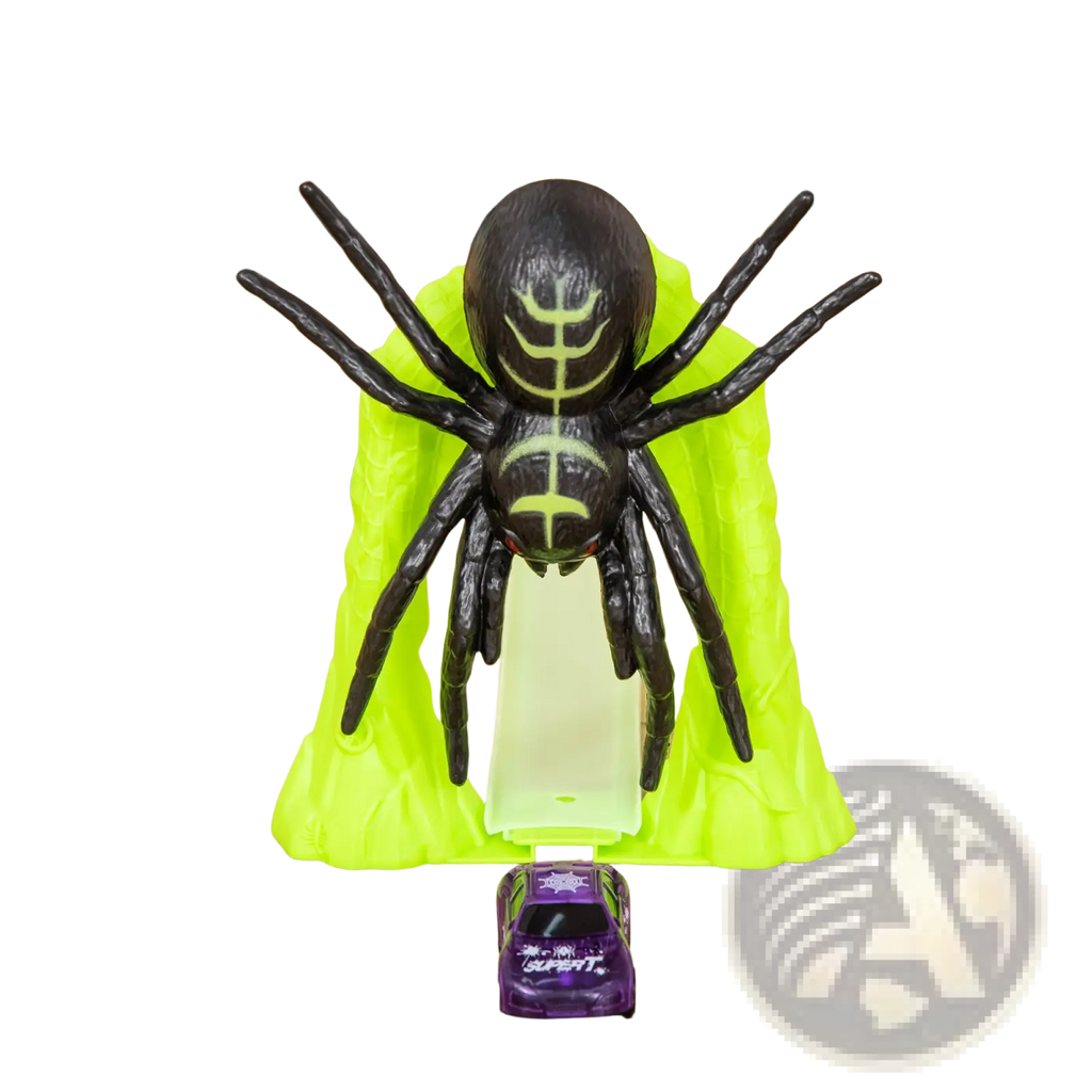 Black plastic spider with glowing green markings and red eyes on lime-green base from glowing race track toy spider loop playset