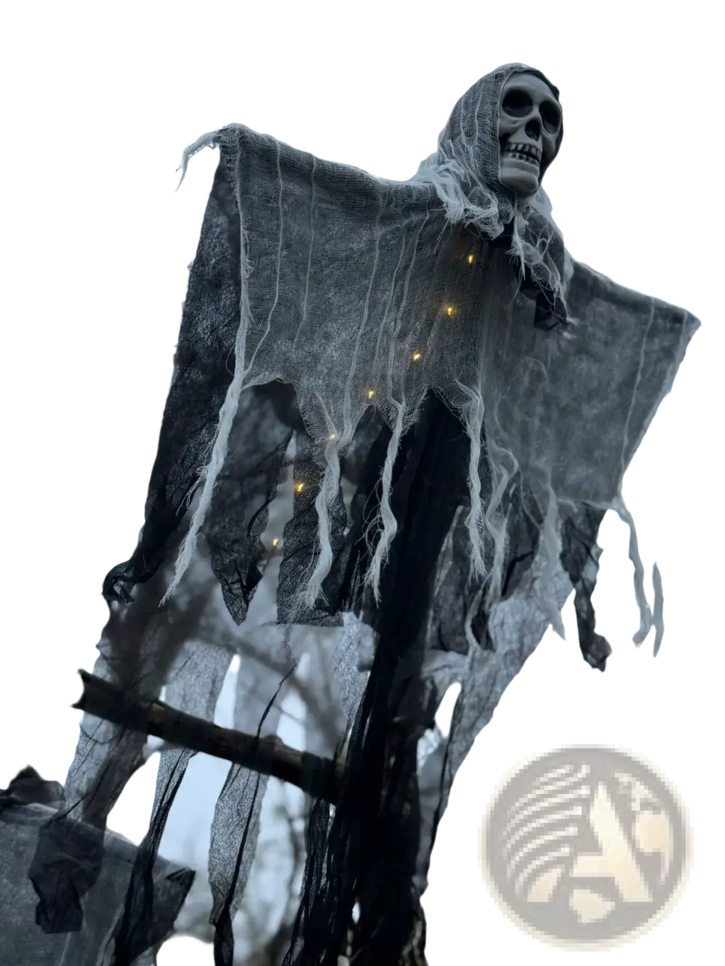 A glowing skull hanging Halloween ghost decoration with a gray skeletal figure draped in tattered black and white mesh