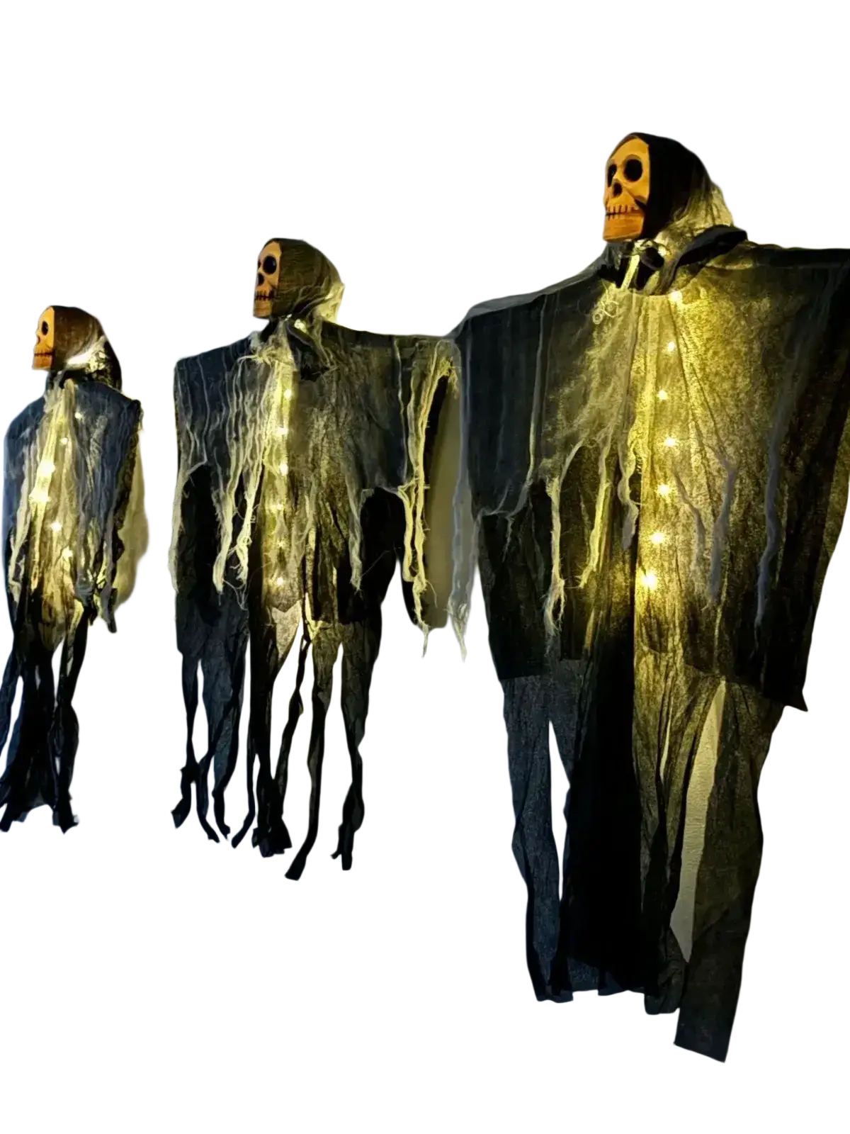 Three glowing skull hanging halloween ghost decorations with illuminated skull faces and dark tattered fabric bodies