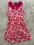 Sleeveless retro gnomes pink cotton a-line dress with bold gnome print and matching bright pink collar belt and hem