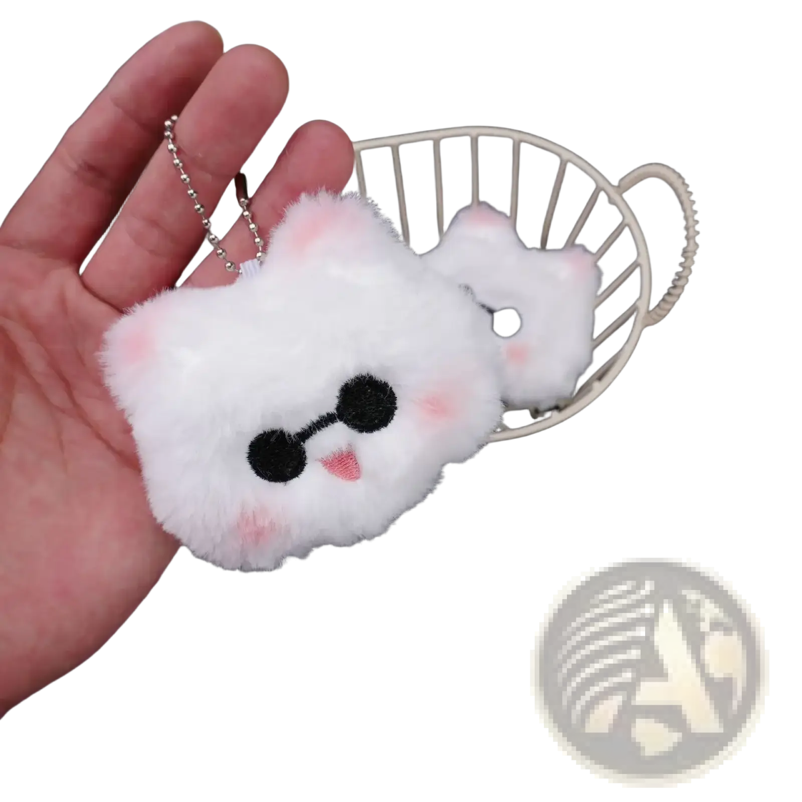 A fluffy white plush cat anime keychain with black embroidered eyes pink cheeks and a tiny tongue from gojo and geto collection