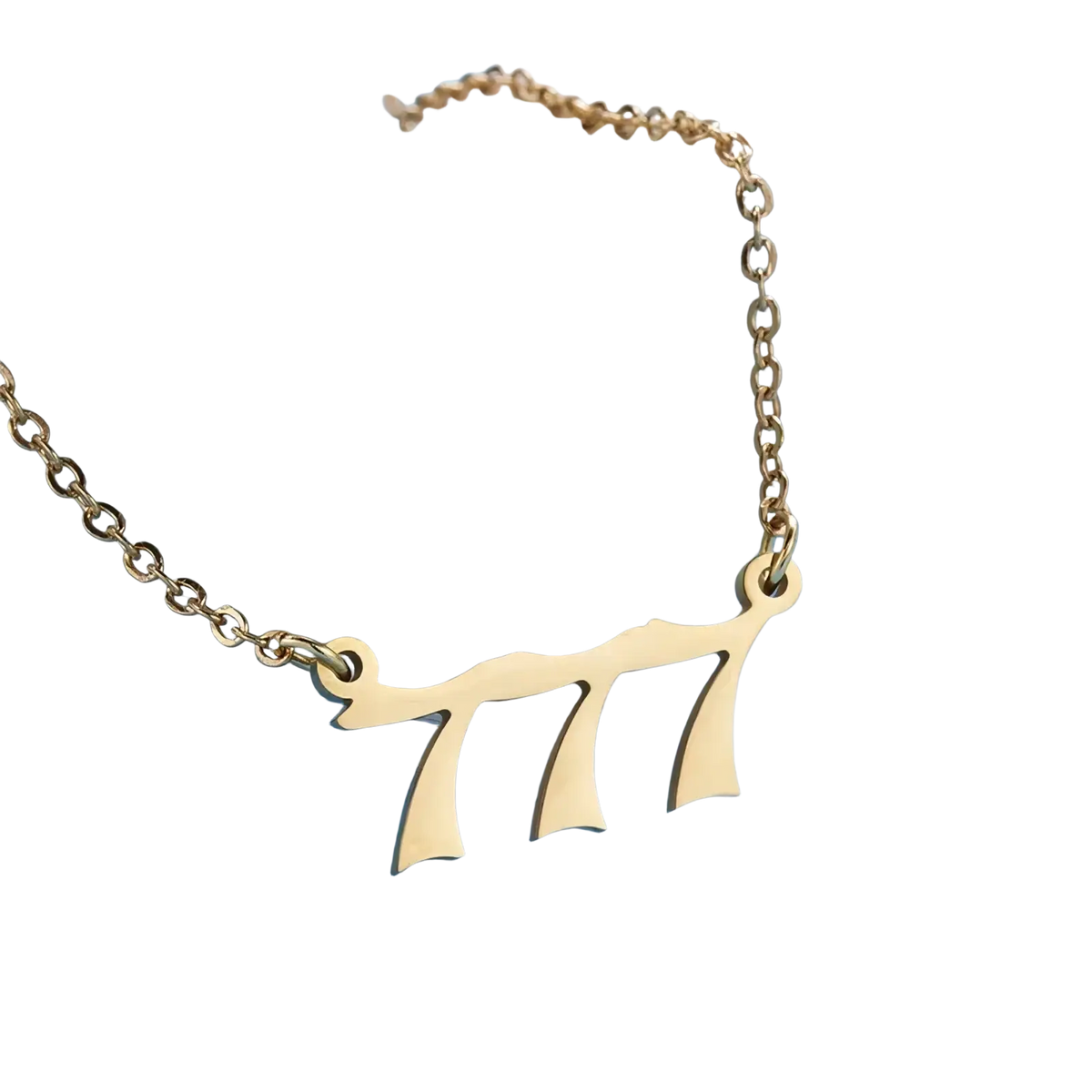 Gold angel number 7 necklace featuring a gold-toned delicate chain with a hebrew letter shin pendant