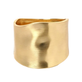 Gold asymmetric wide bangle bracelet with gold-toned brushed metallic finish and slightly curved edges