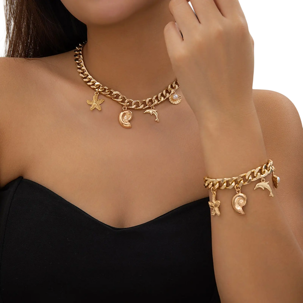 Gold boho sea charm choker and bracelet set with gold-toned chunky chain and starfish dolphin seashell crescent moon charms