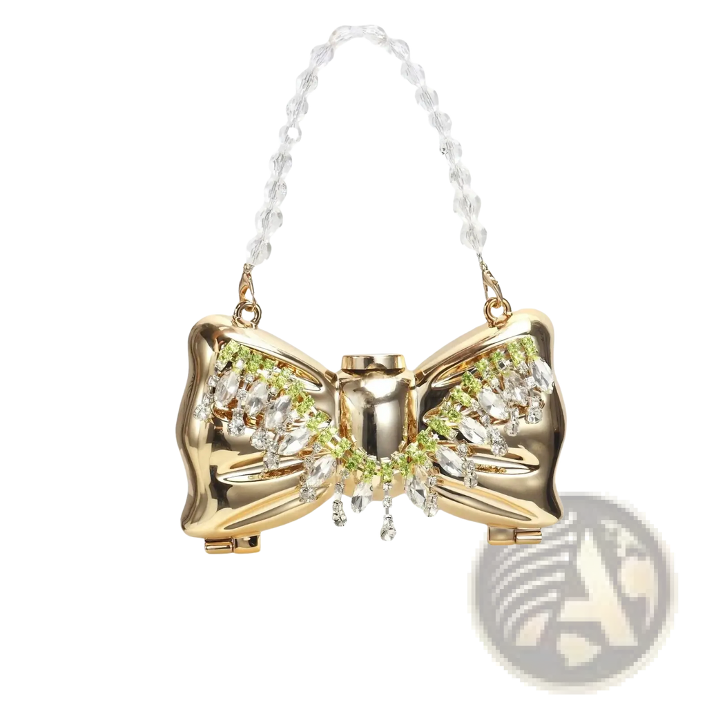 Gold bow metal clutch crossbody bag featuring a gold-colored bow shape with clear and green crystals and a beaded chain strap