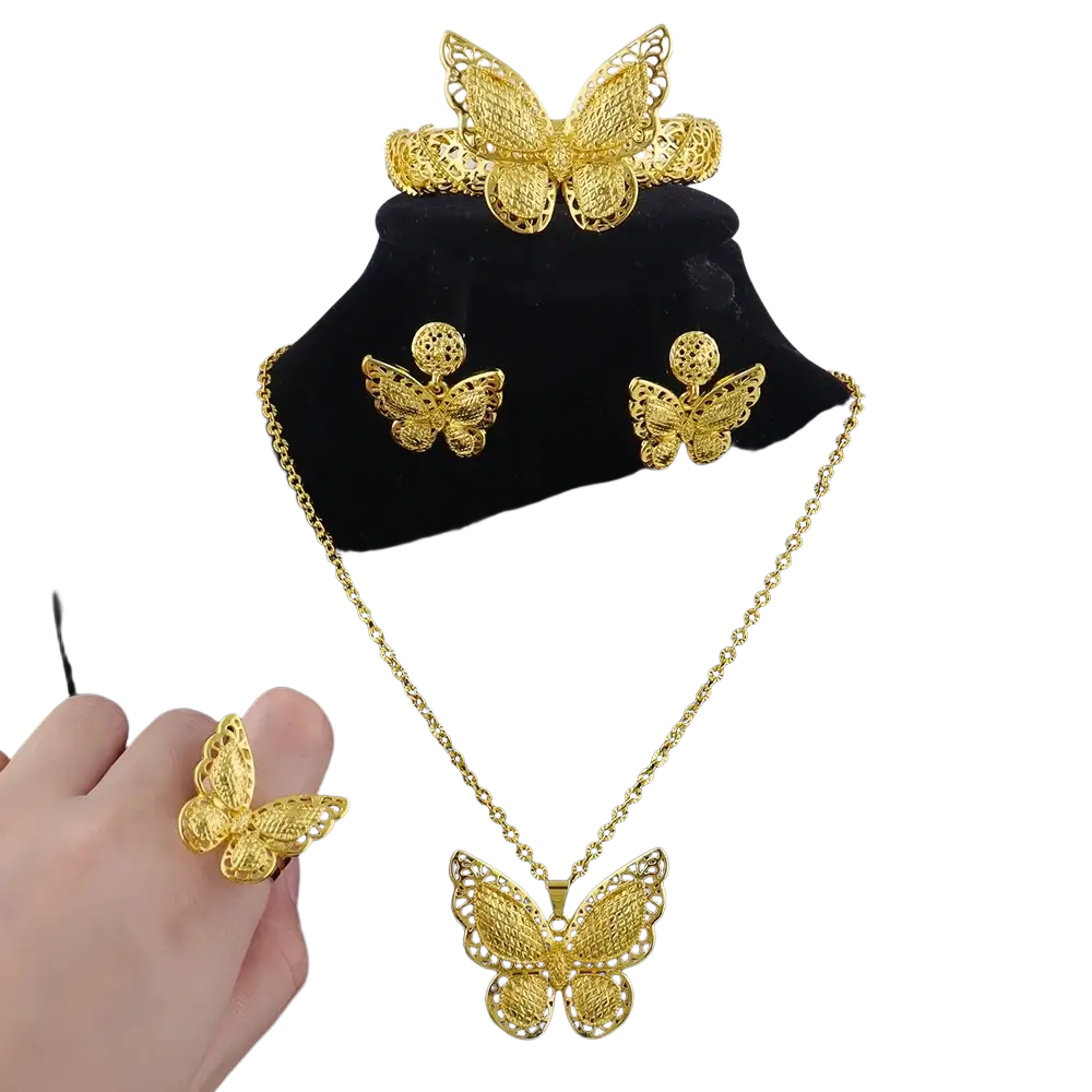 Gold butterfly jewelry set 4-piece gold plated with intricate filigree detailing on necklace earrings ring and headpiece