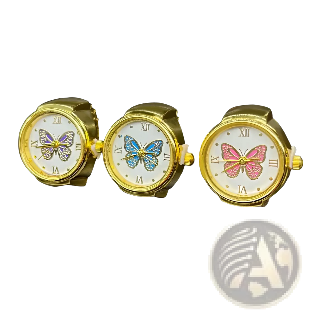Three gold-toned stainless steel butterfly-themed wristwatches with white faces and colorful enamel butterflies