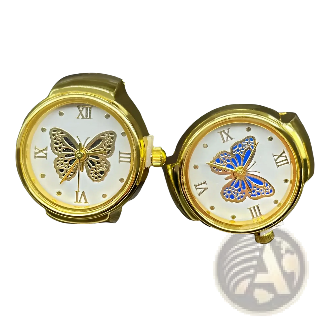 Two gold-toned stainless steel butterfly wristwatches with white faces roman numerals and intricate metalwork details