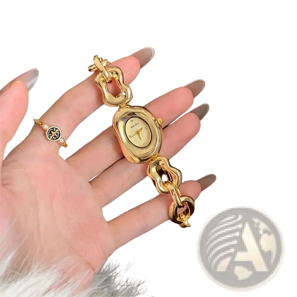Gold chain link vintage wristwatch with an oval face and chunky gold-toned interlocking chain bracelet