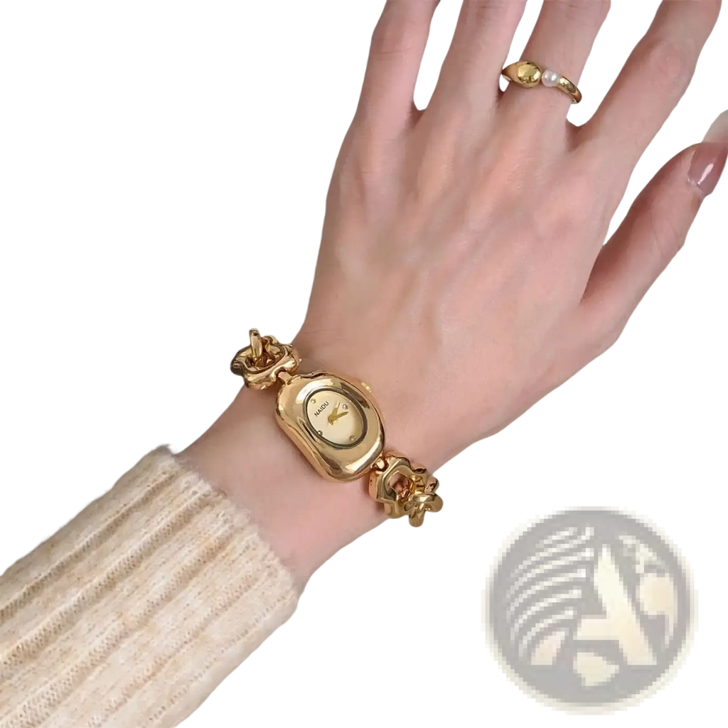 Gold chain link vintage wristwatch with gold-toned rectangular face and ornate chain-link bracelet