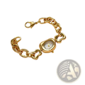 Gold chain link vintage wristwatch featuring a gold-toned chunky chain bracelet with an oval face