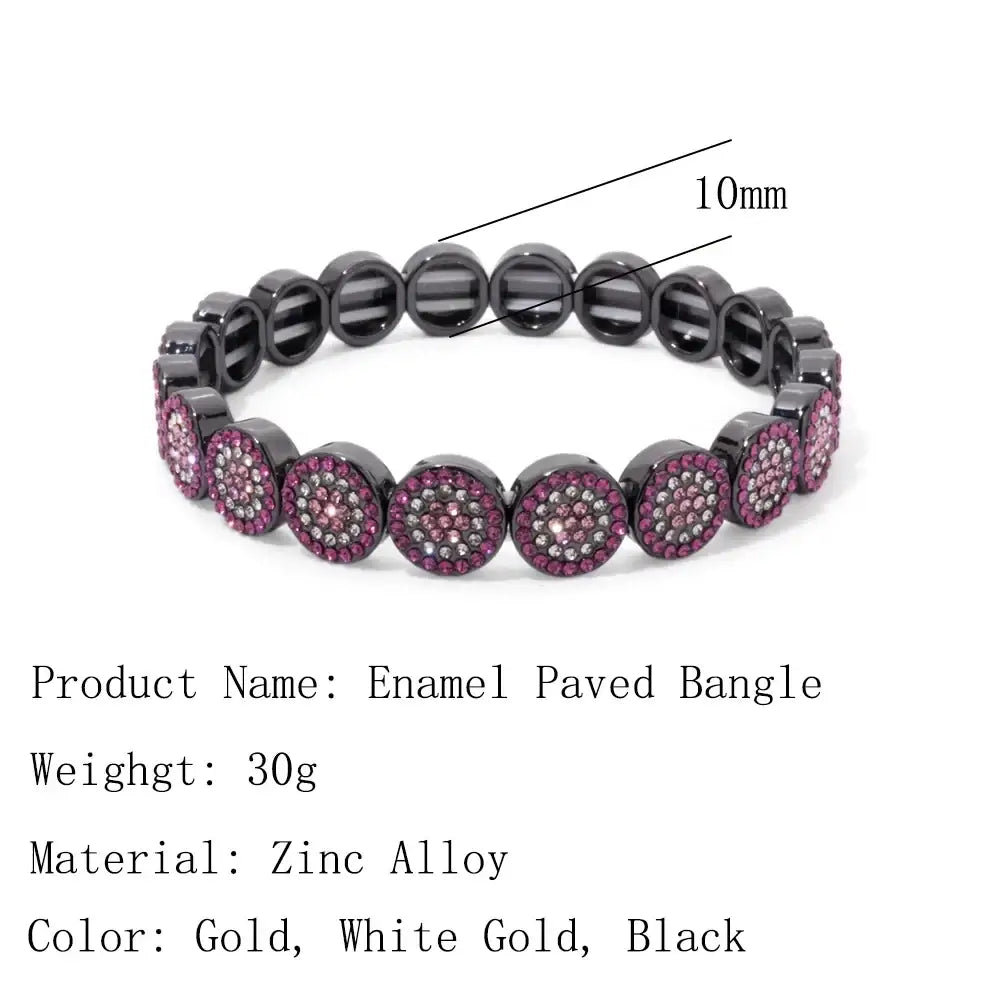 Gold color zinc alloy bangle style crystal bracelet with black enamel and pink clear rhinestone circular design