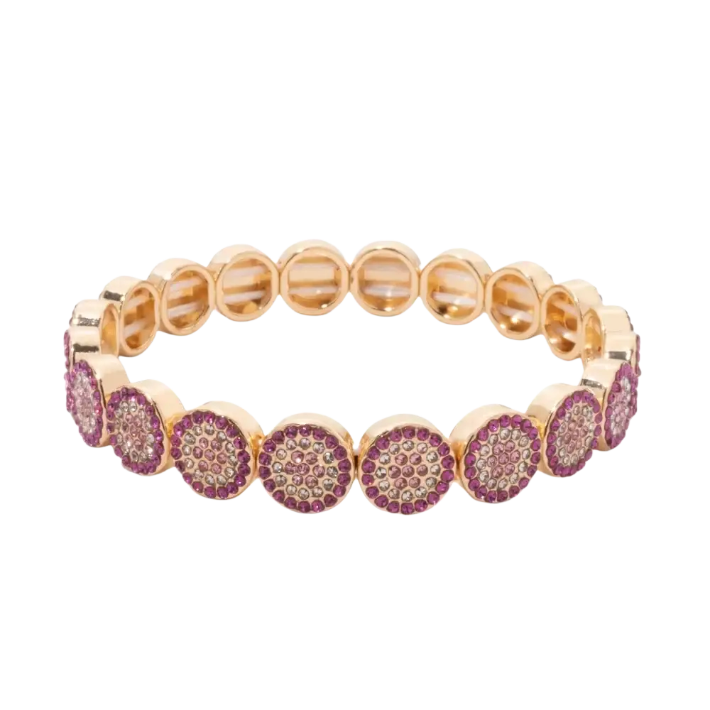 A gold color zinc alloy bangle style bracelet adorned with circular clusters of pink and clear crystals