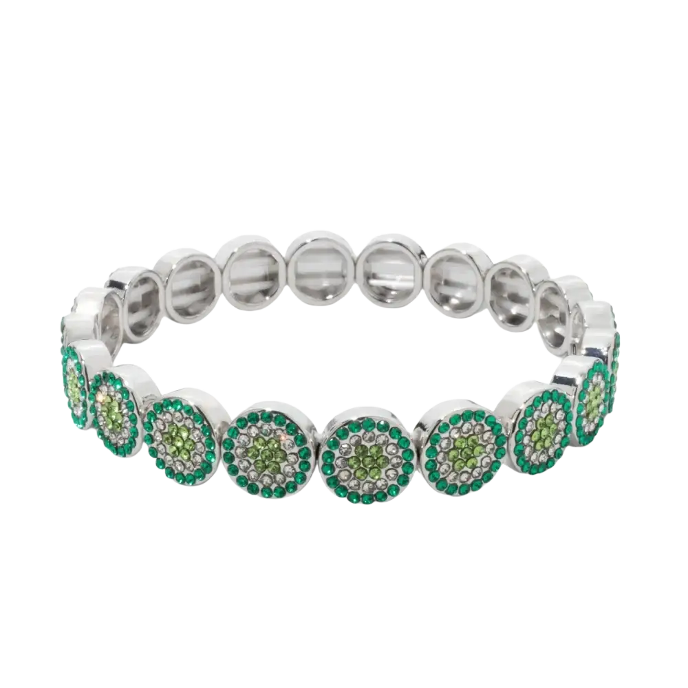 Silver-toned stretch bangle style bracelet with circular motifs featuring green and clear crystals in zinc alloy