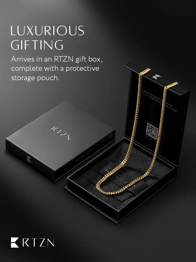 A sleek gold colored 18k gold plated 3.5mm cuban link chain necklace with bold interlocking links in a black rtzn gift box