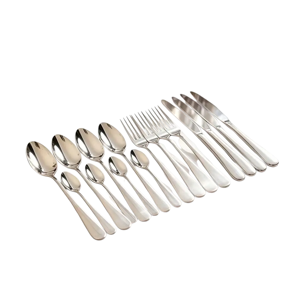 Gold cutlery set featuring polished stainless steel tableware with sleek modern handles arranged on a white cloth