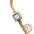 Gold diamond square watch with gold-toned diamond bezel roman numerals and ornate snake-like metal bracelet