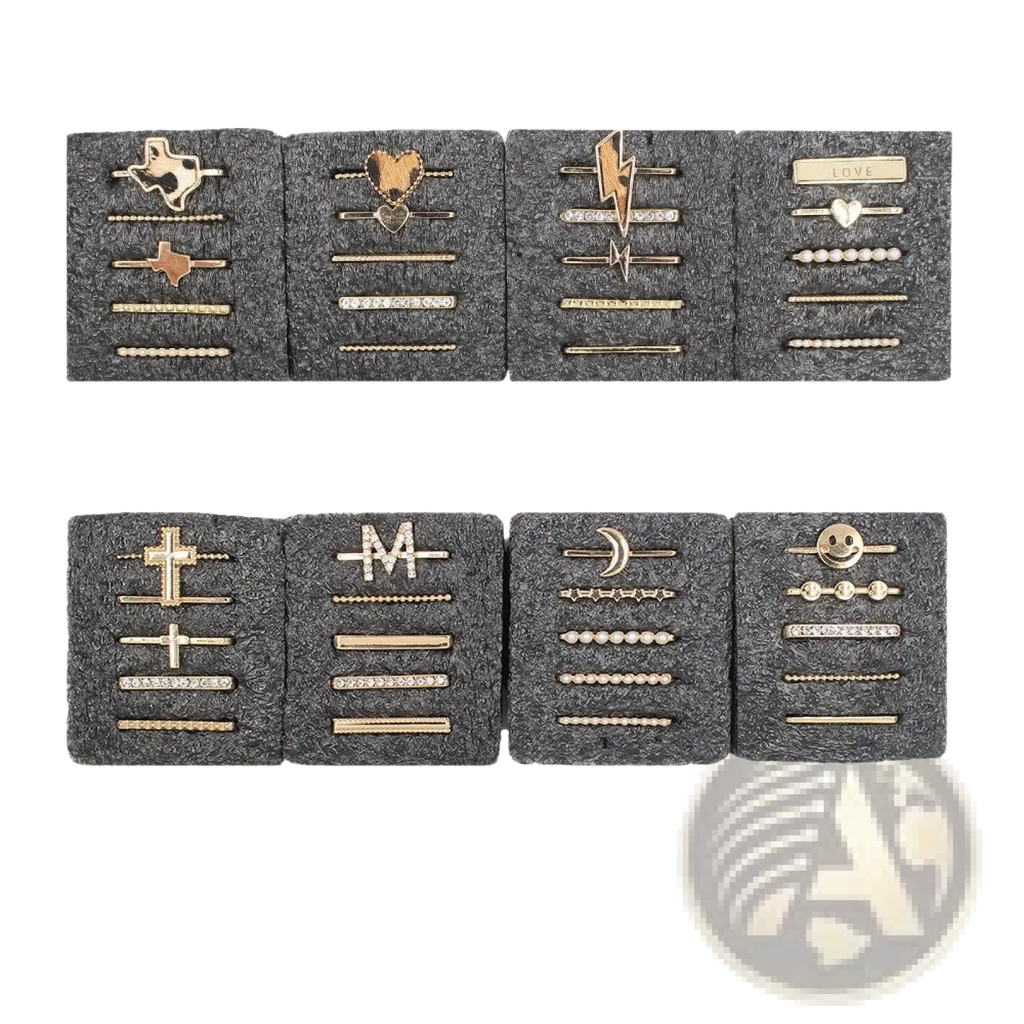 Gold-toned hairpins in various designs including Texas shape, heart, lightning bolt, and smiley face embellish silicone strap ring set